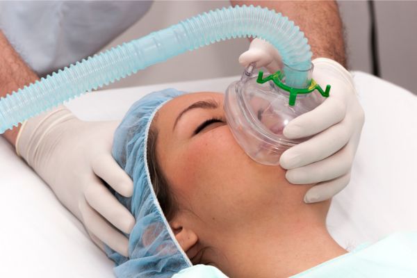 patient with an oxygen mask over her face