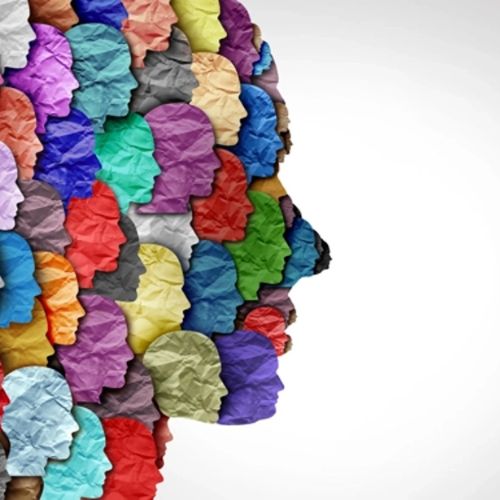 Graphic of a side profile of a head made with paper cutouts of smaller heads