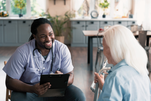 healthcare professional with stethascope speaking to patient