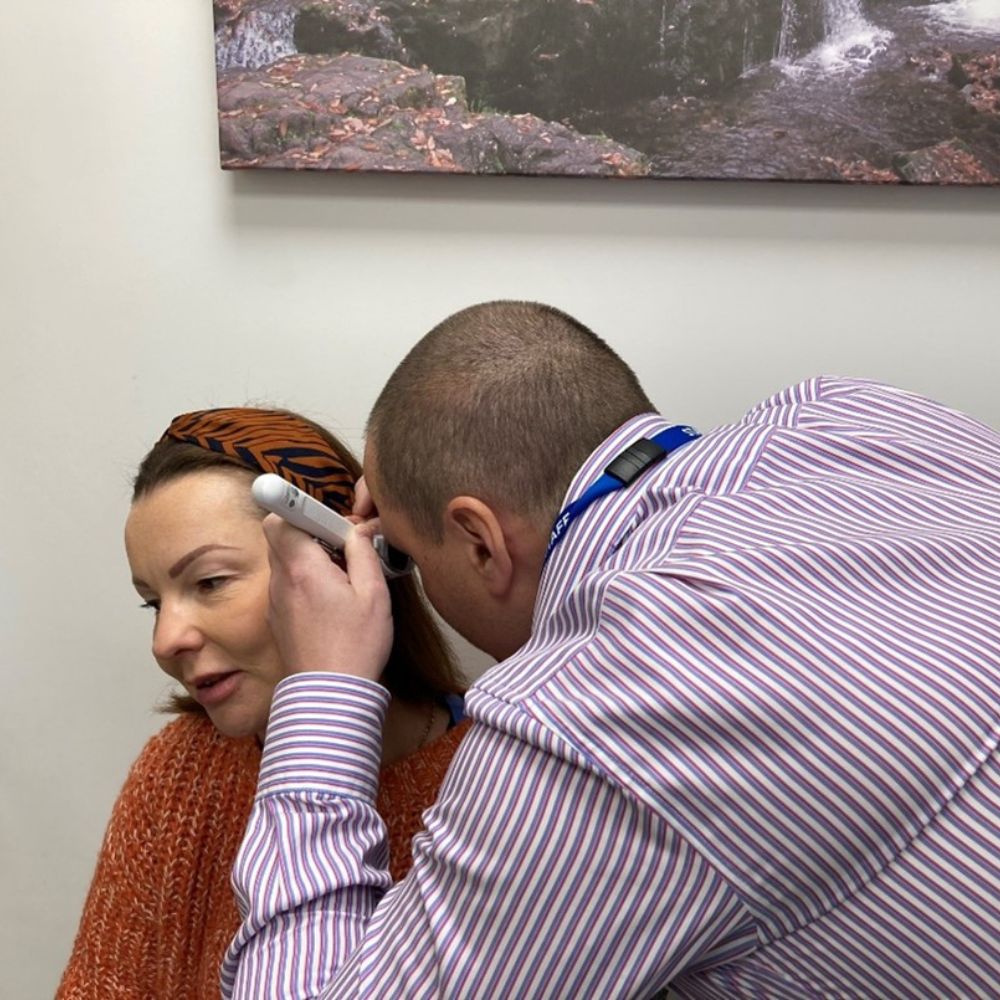 Healthcare professional examining a patient