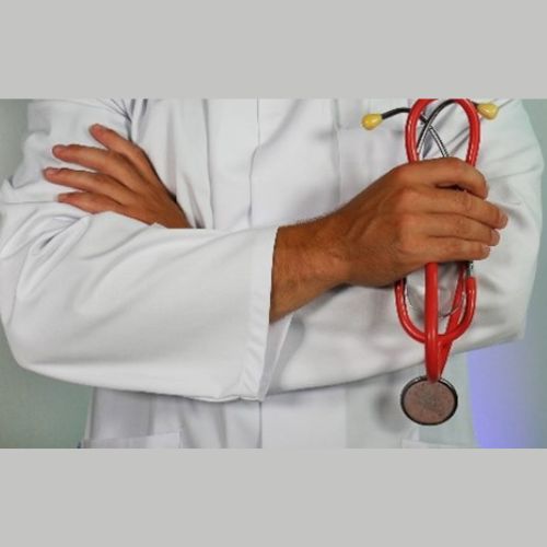 person in a lab coat holding a stethoscope
