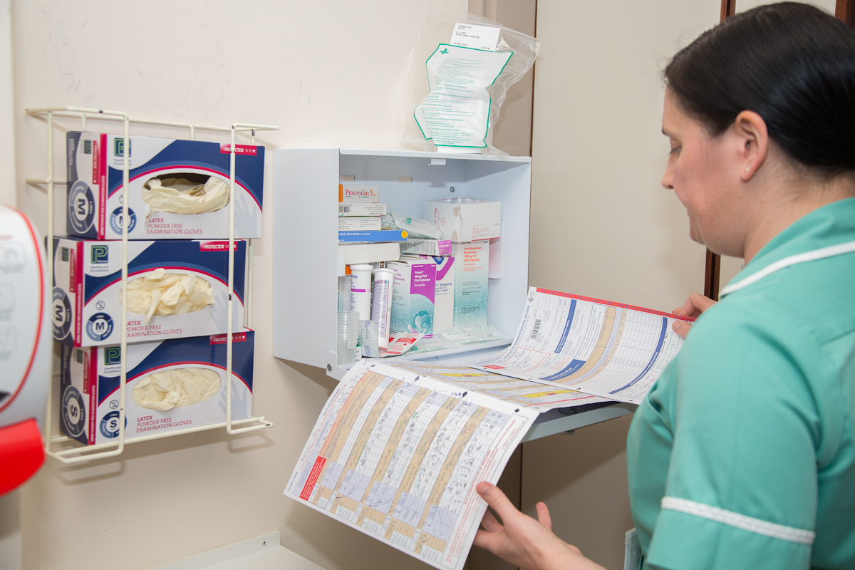 A healthcare professional examining patient notes