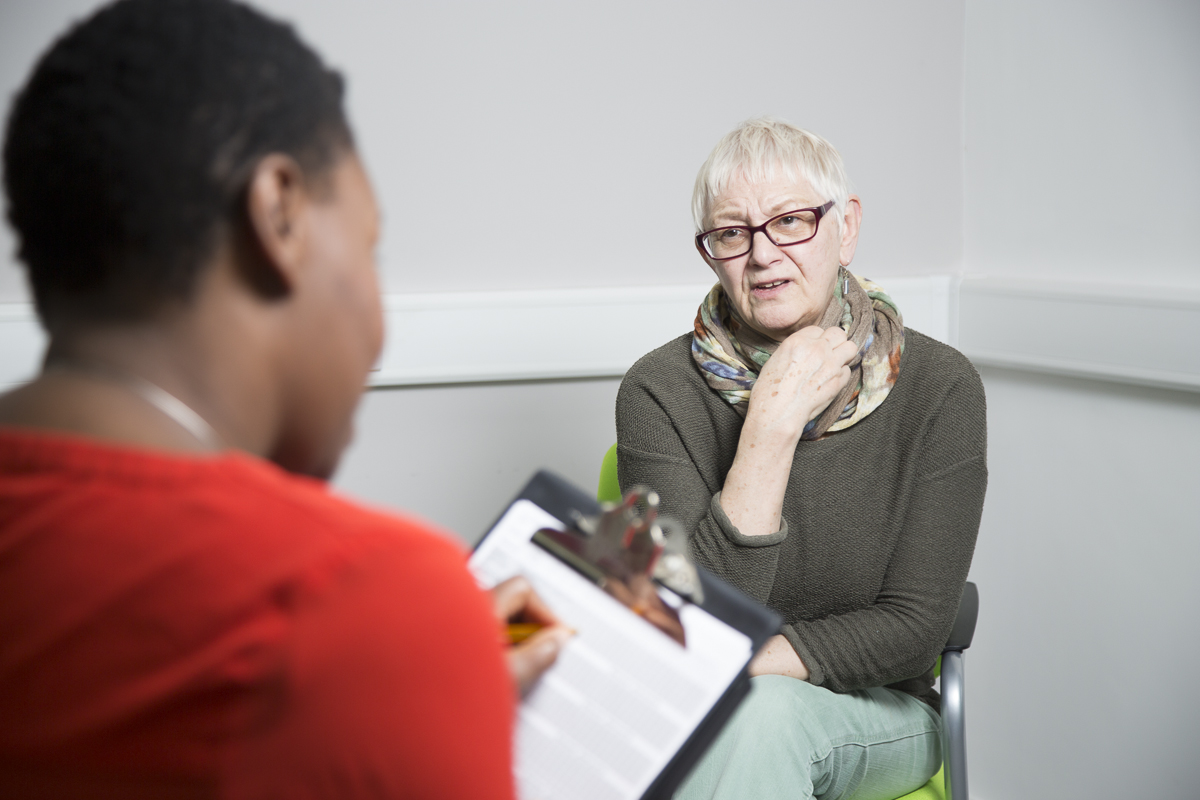 A healthcare professional not dressed in uniform with a patient