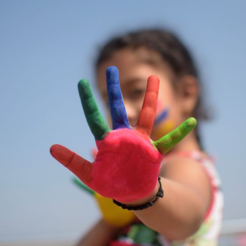 Child with paint on her hands