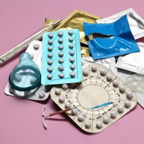Various contraceptive methods displayed, including pills, condoms, an IUD, and a thermometer.