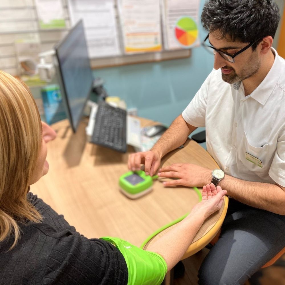 healthcare professional checking a patient's blood preassure