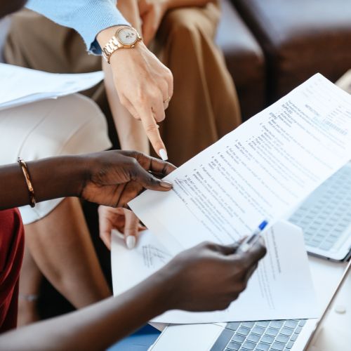 A document being reviewed by multiple people