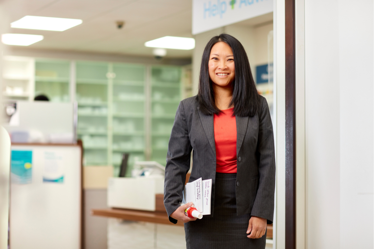 Healthcare professional in an office holding paperwork