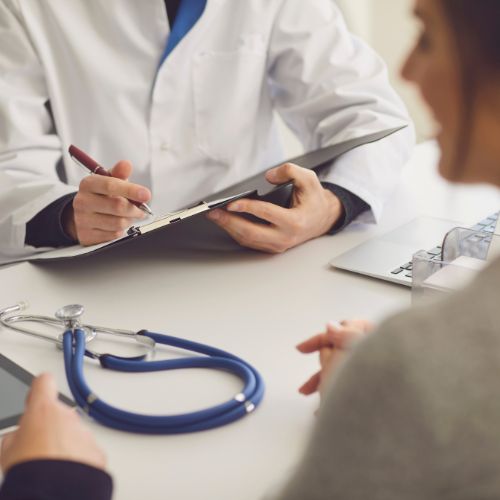 Patient in consultation with a healthcare professional in clinic