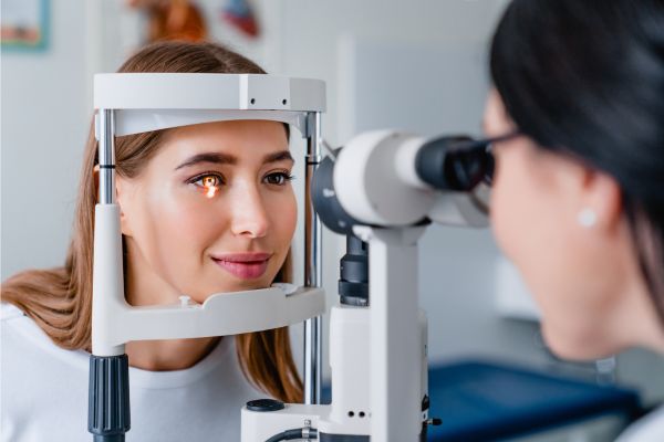 healthcare professional examining a patient's eye