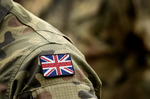 Person in army uniform, zoomed in on their shoulder which has a Union Jack on it