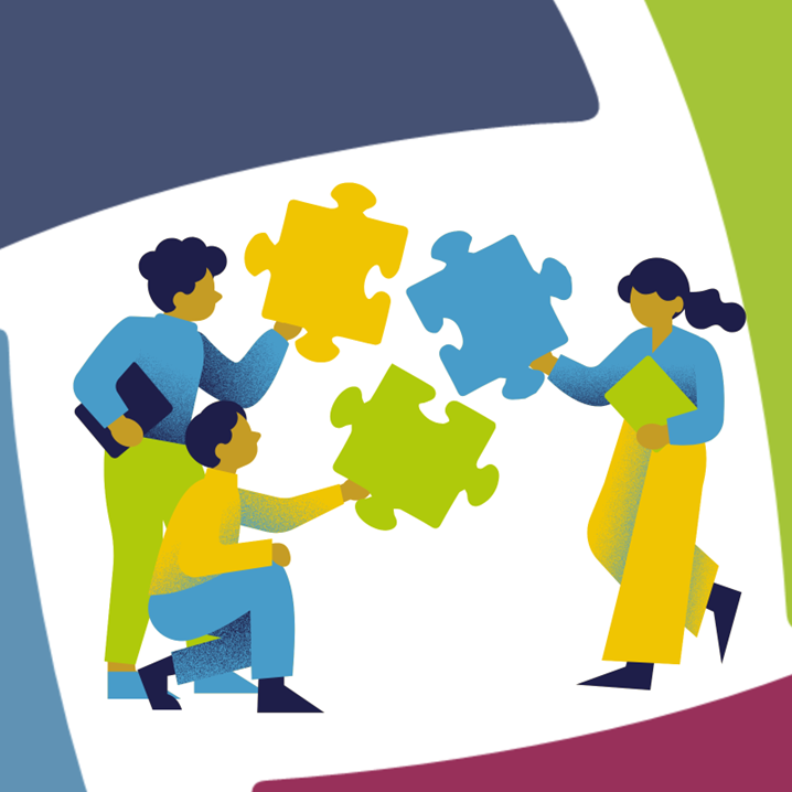 people holding giant puzzle pieces